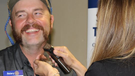 Rotary member shaves beard to help raise $6,000 for CASA