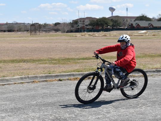 A 'WHEELIE' GOOD TIME: Mendez Elementary students practice their bike-riding skills