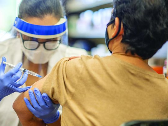 After pandemic year, weary world looks back — and forward