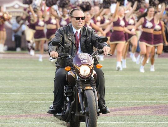 ALL REVVED UP: TXST President rides into Bobcat Stadium during home opener