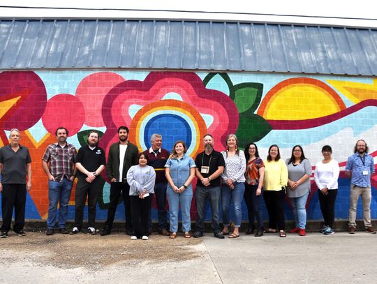 Artist creates breath of spring in new mural