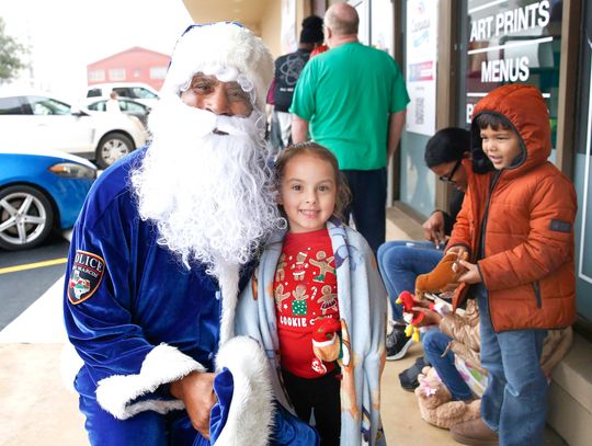 Blue Santa gifts toys to record number of families