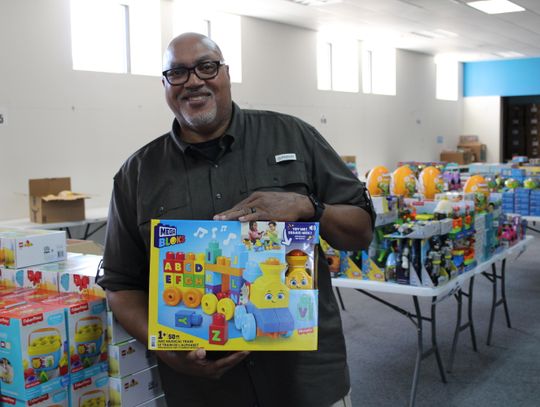 Blue Santa in need of gift wrapping assistance