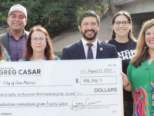 City receives million dollar check for east and west sidewalk connection