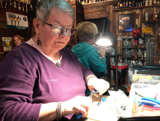 Crafting jewelry at craft beer bar