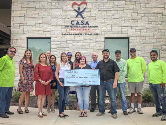FOR THE CHILDREN: Divided Sky Roofing, Rotary Club make donations to CASA