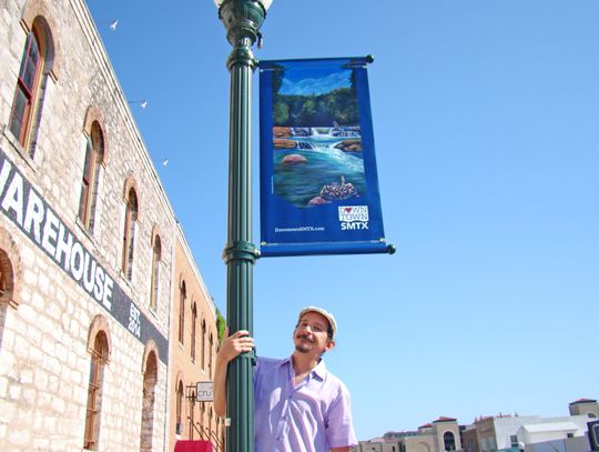 Local artist brightens downtown San Marcos with banner paintings 