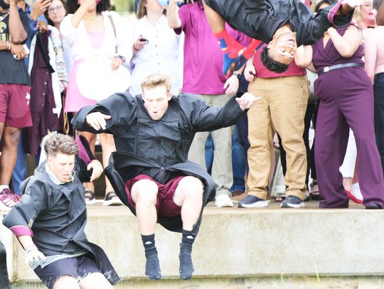 MAKING A SPLASH: TXST grads celebrate with traditional river jump