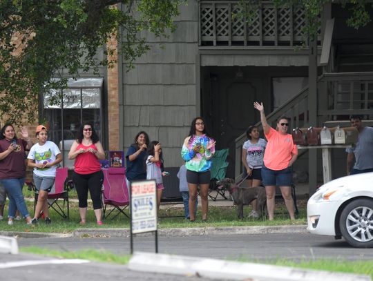 Miller Middle School teachers, staff visit students during parade