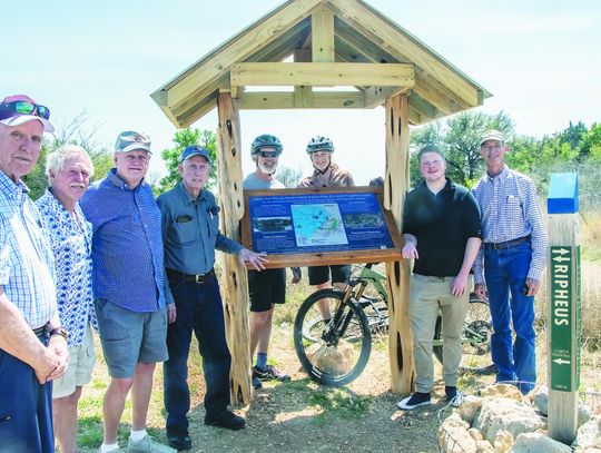 Newly installed sign in Lower Purgatory Greenspace explains flood control dam