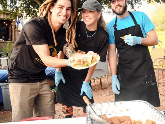 Polespear tournament removes invasive species from river, feeds community 