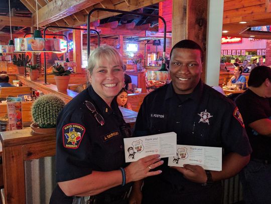 Police trade badges for serving aprons