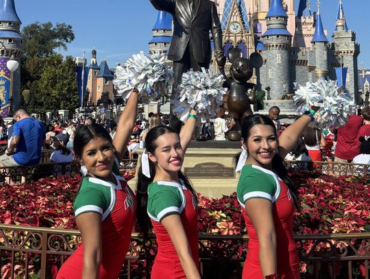 Senior cheerleading trio perform at Varsity Spirit Spectacular at Walt Disney World