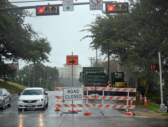 Sidewalk construction closes roadway