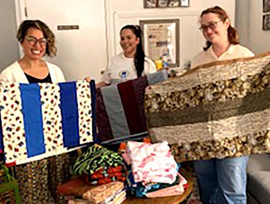 SMUUF Sewing Guild donates children's quilts