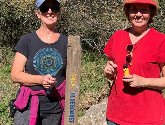 TRAIL WORK: San Marcos Bluebonnet Lions Club paints trail sign