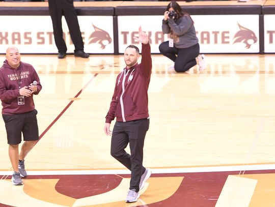 WARM WELCOME: Crowd at basketball game greets new TXST head football coach 