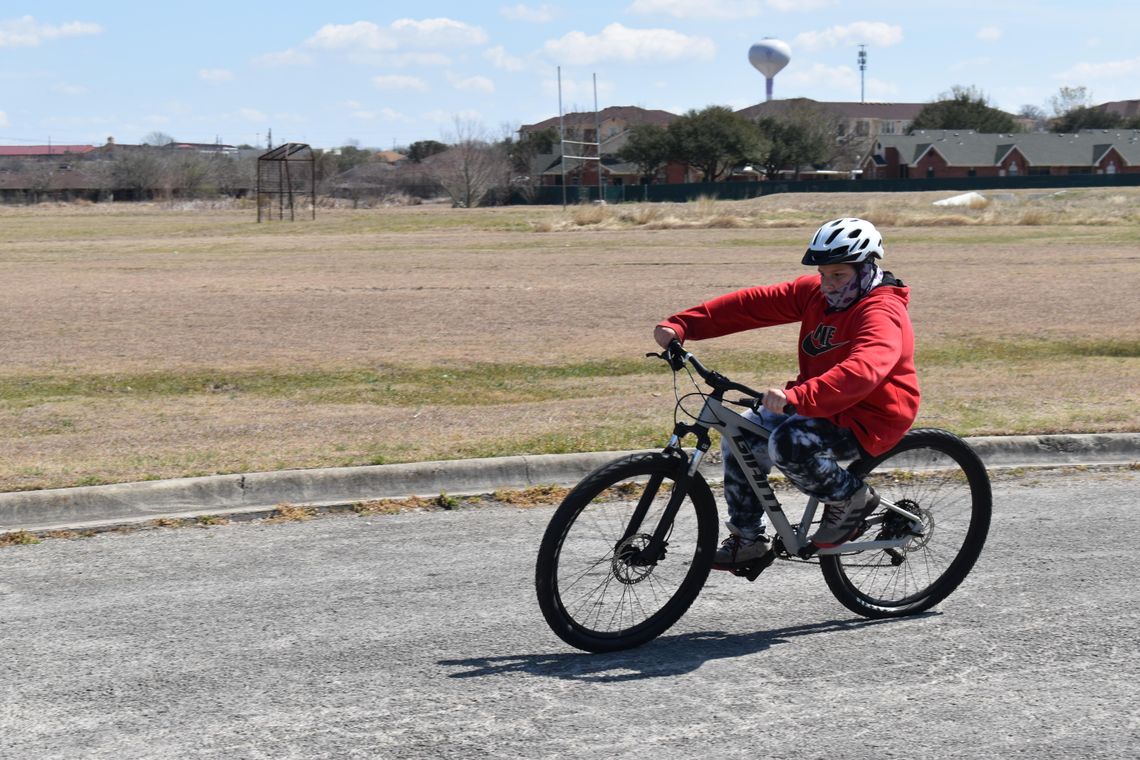 A 'WHEELIE' GOOD TIME: Mendez Elementary students practice their bike-riding skills