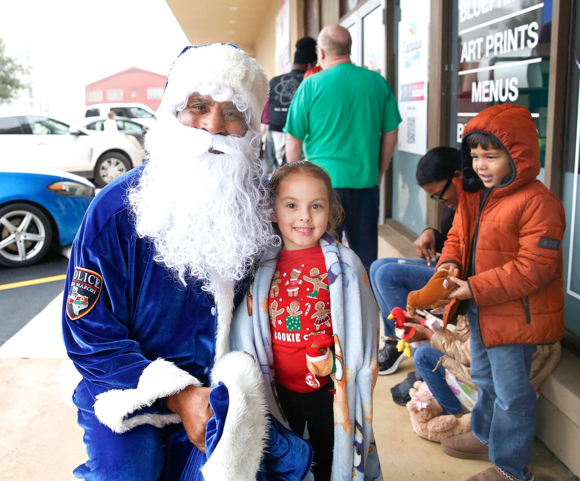 Blue Santa gifts toys to record number of families