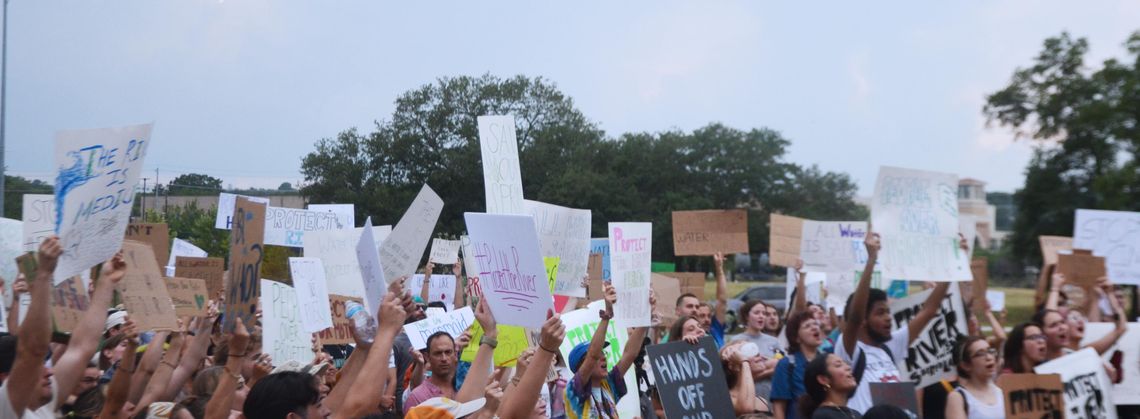 During protest against film production studio, city councilmember announces economic deal to be reconsidered 