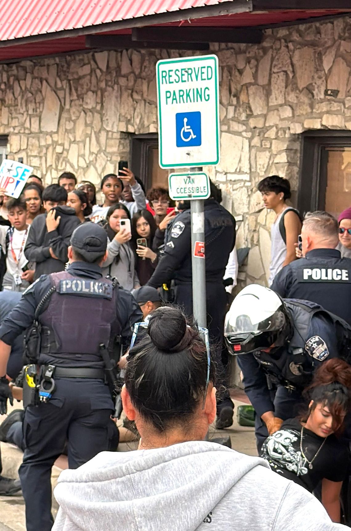 Fight between adult male and students during Buda protest leads to DA investigation Fight between adult male and students during Buda protest leads to DA investigation