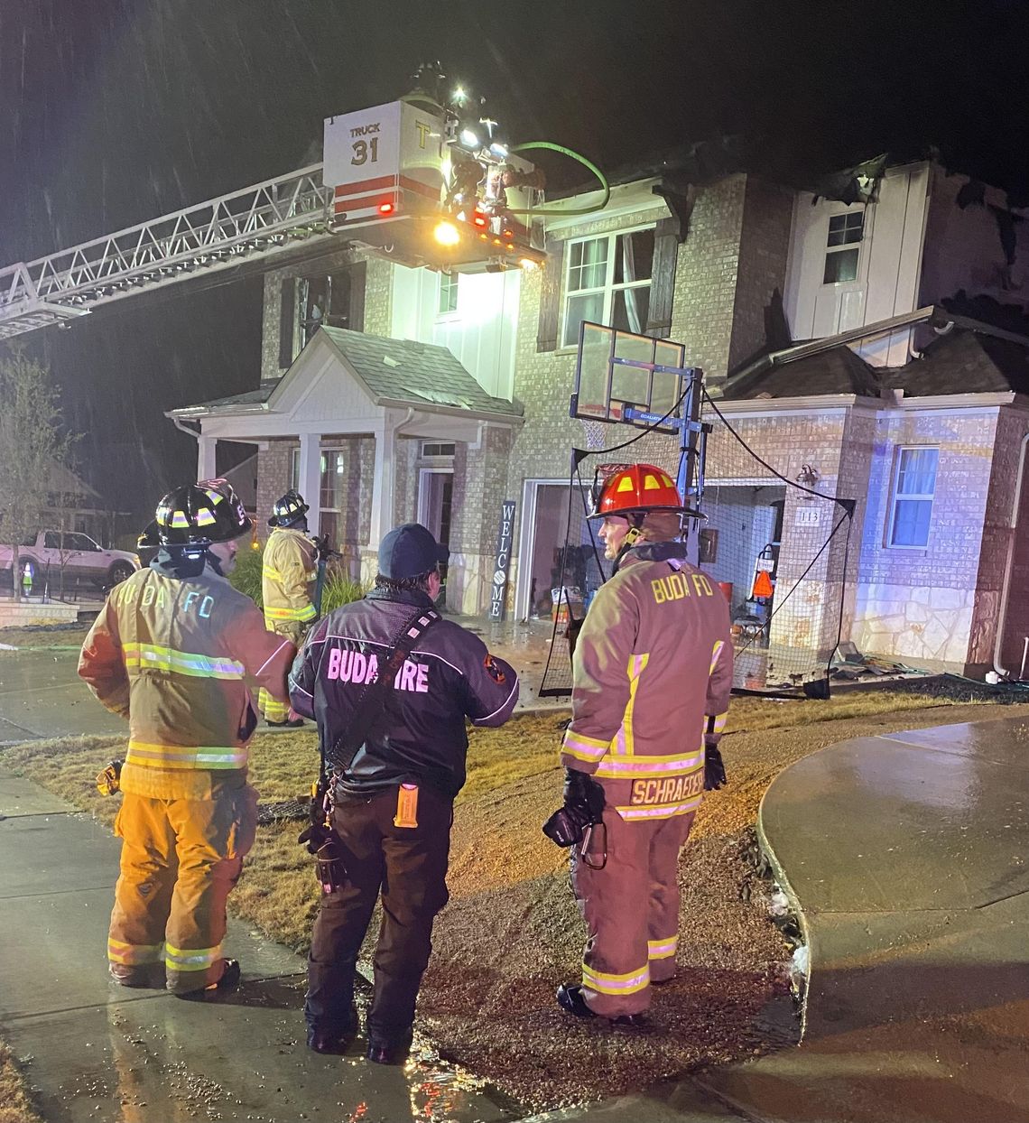 Firefighters battle Buda house fire