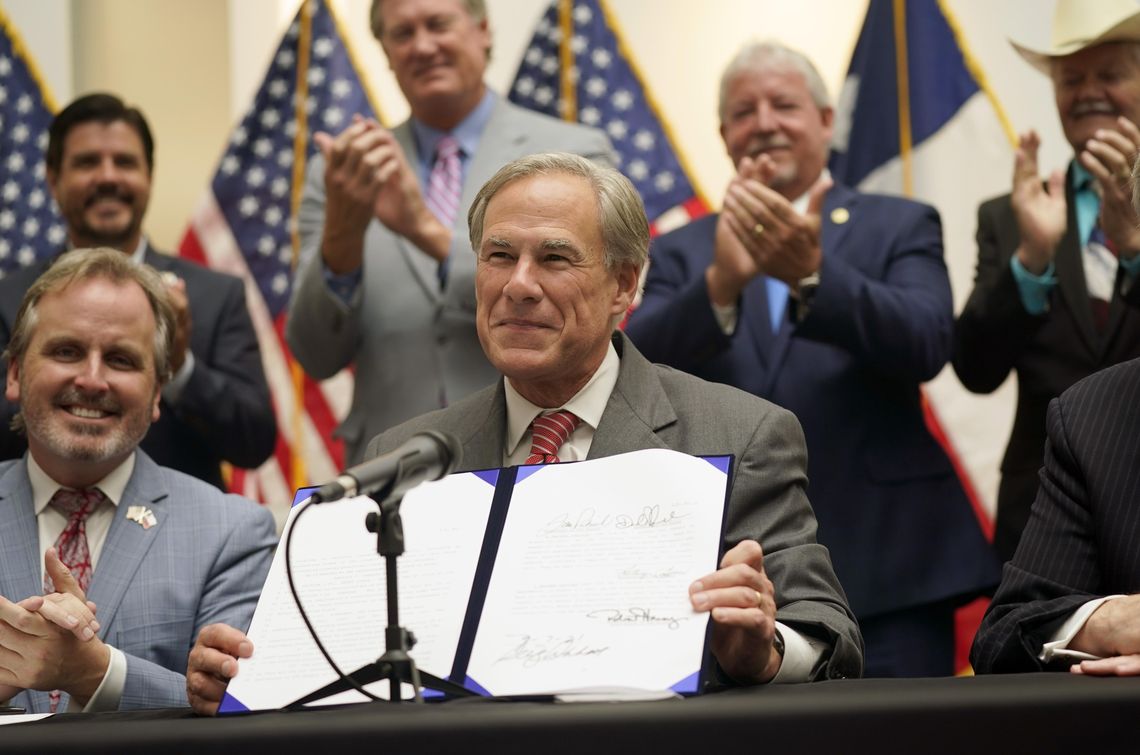 Governor signs Texas voting bill into law Governor signs Texas voting bill into law