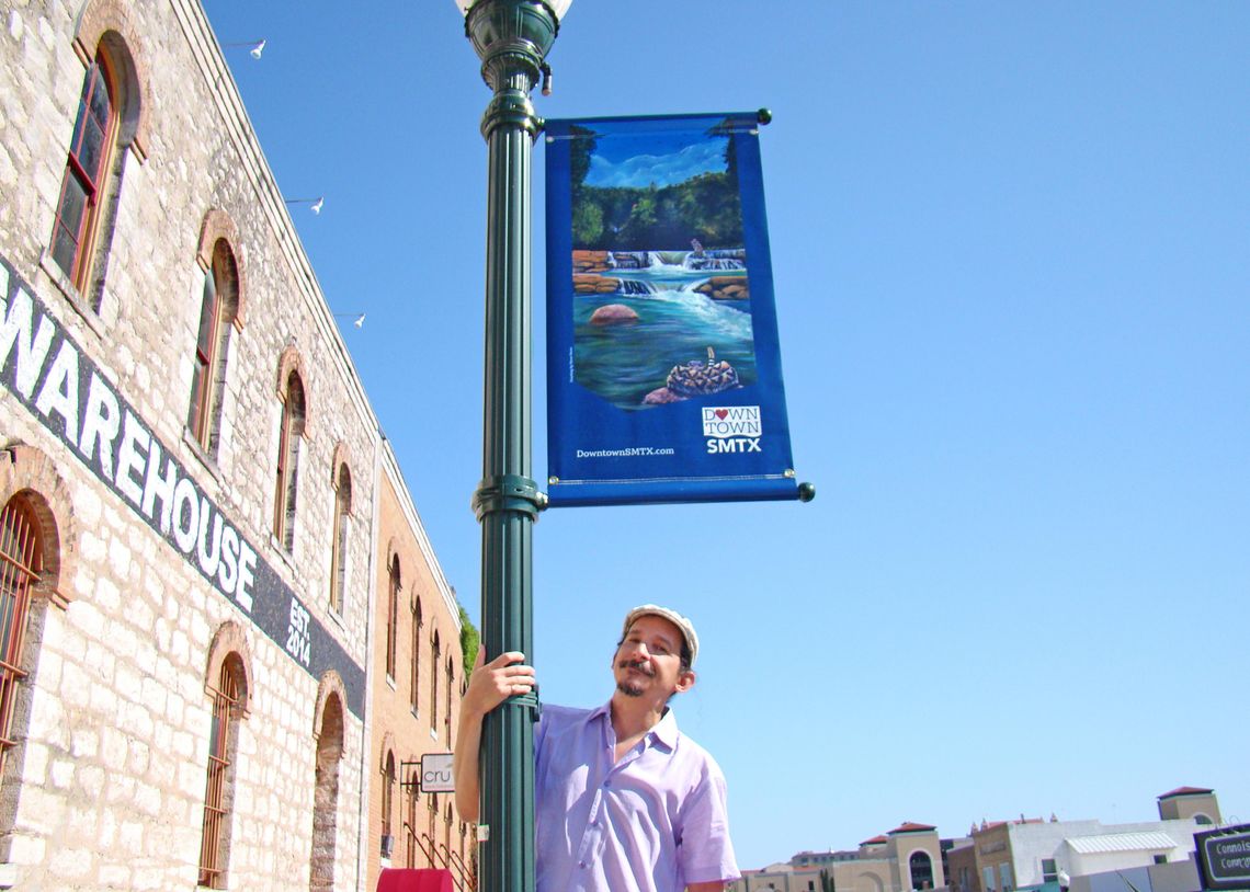 Local artist brightens downtown San Marcos with banner paintings 