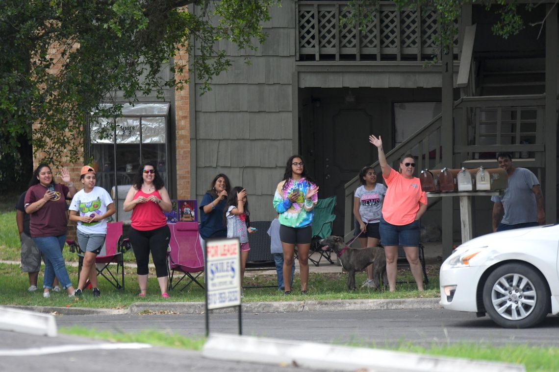 Miller Middle School teachers, staff visit students during parade