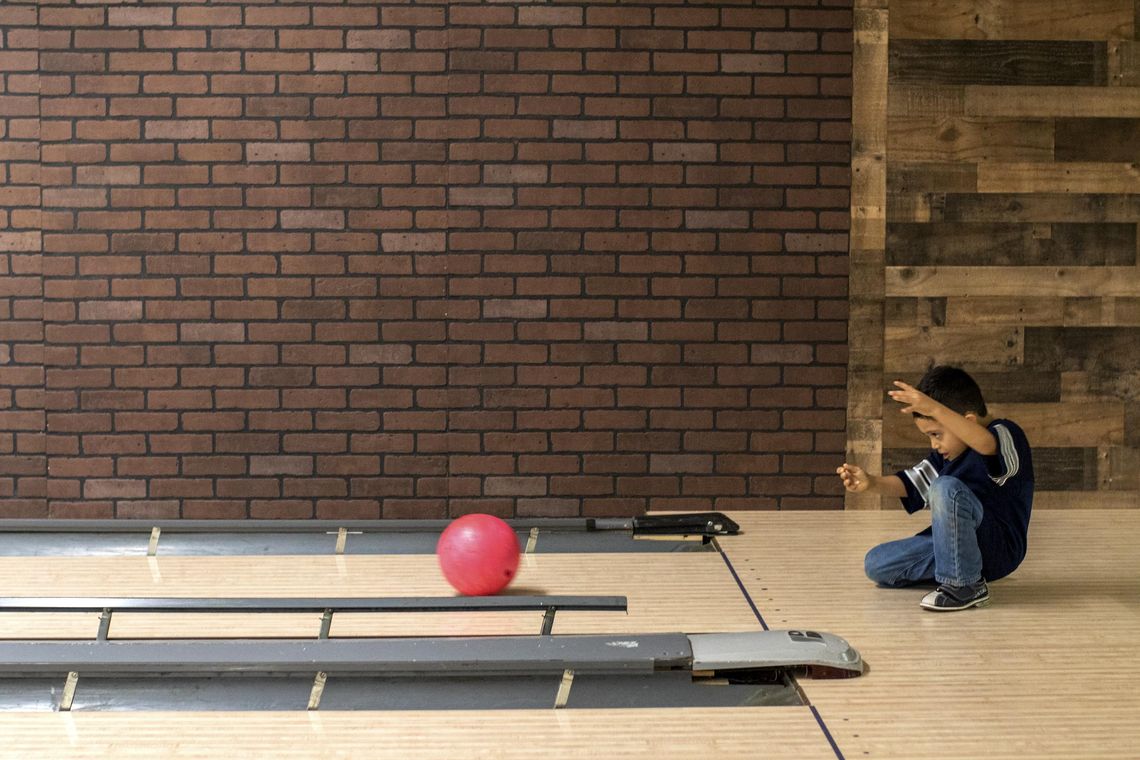 Mothers and sons go bowling