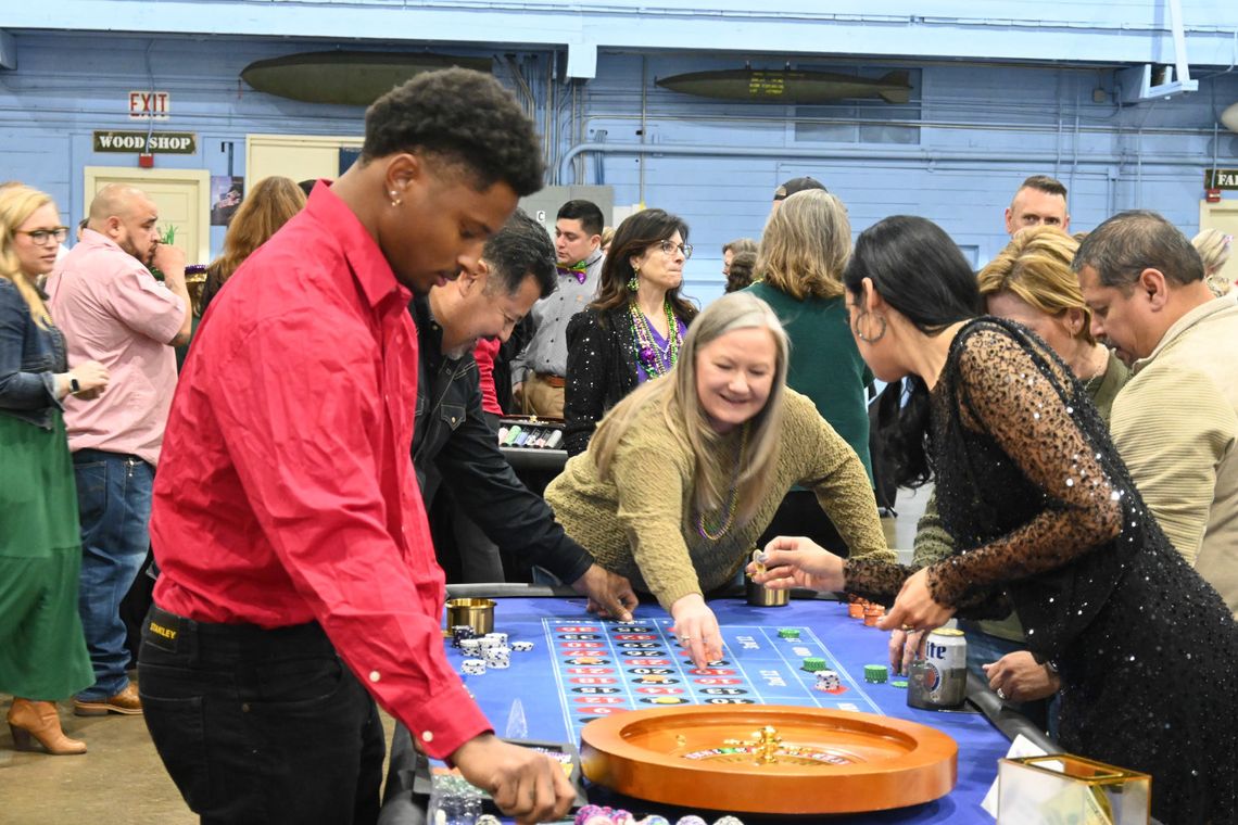 Rotary Casino Night combines Mardi Gras fun with Air Force history