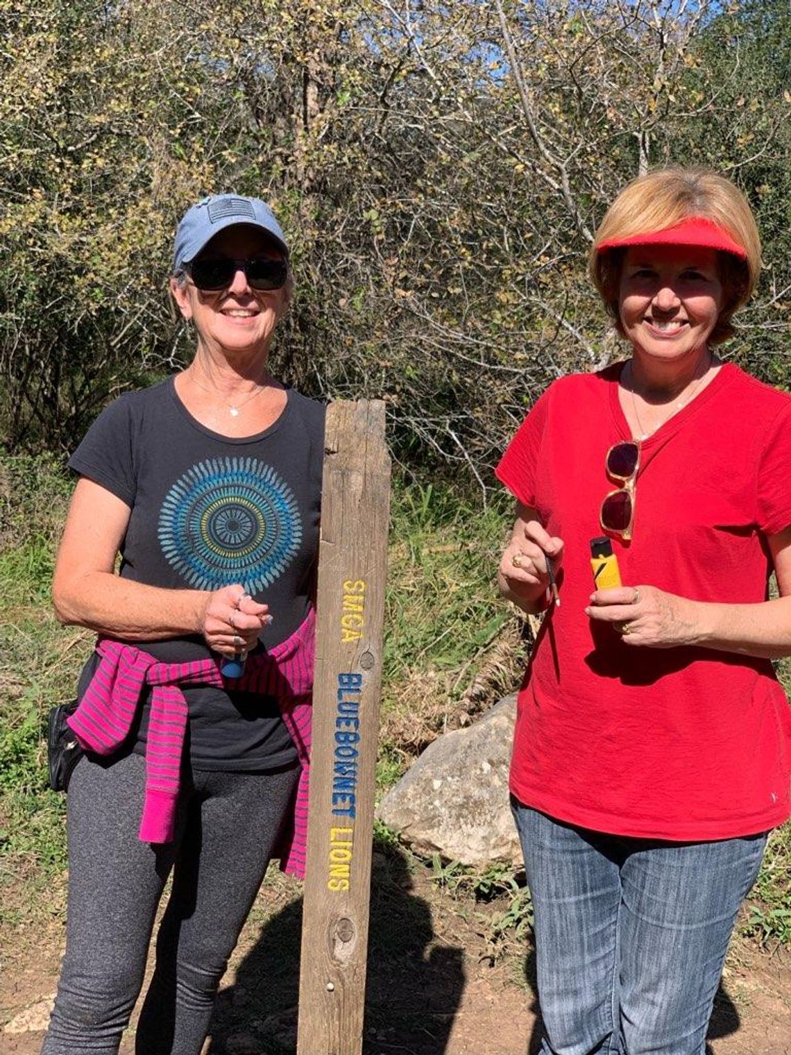 TRAIL WORK: San Marcos Bluebonnet Lions Club paints trail sign