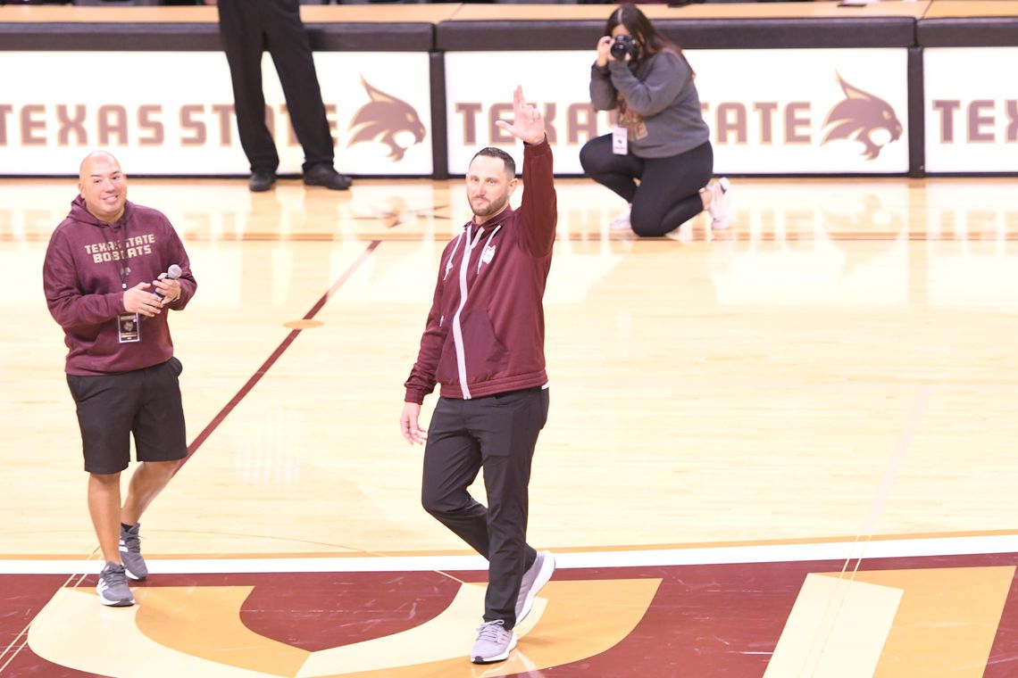 WARM WELCOME: Crowd at basketball game greets new TXST head football coach 