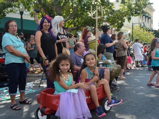 Cousins Cassy Franco and Frida Aguilar had a front row seat to the view the promenade filled with mermaids and bright colors.