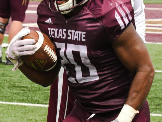 Sophmore running back Robert Brown Jr. rushes during Texas State's scrimmage on Satuday.