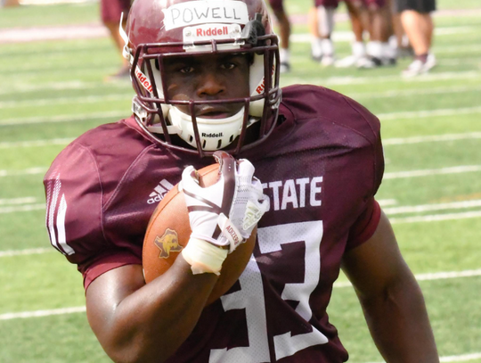 Freshman running back  Cade Powll runs the ball at the Bobcats' scrimmage.